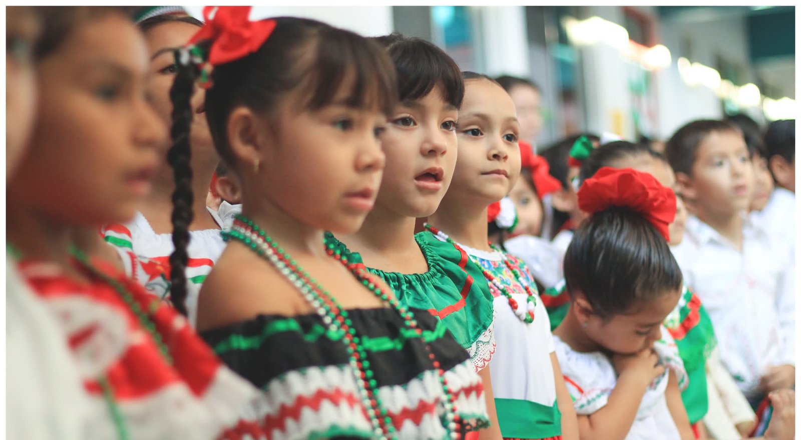 Students in traditional dress performing a folk dance