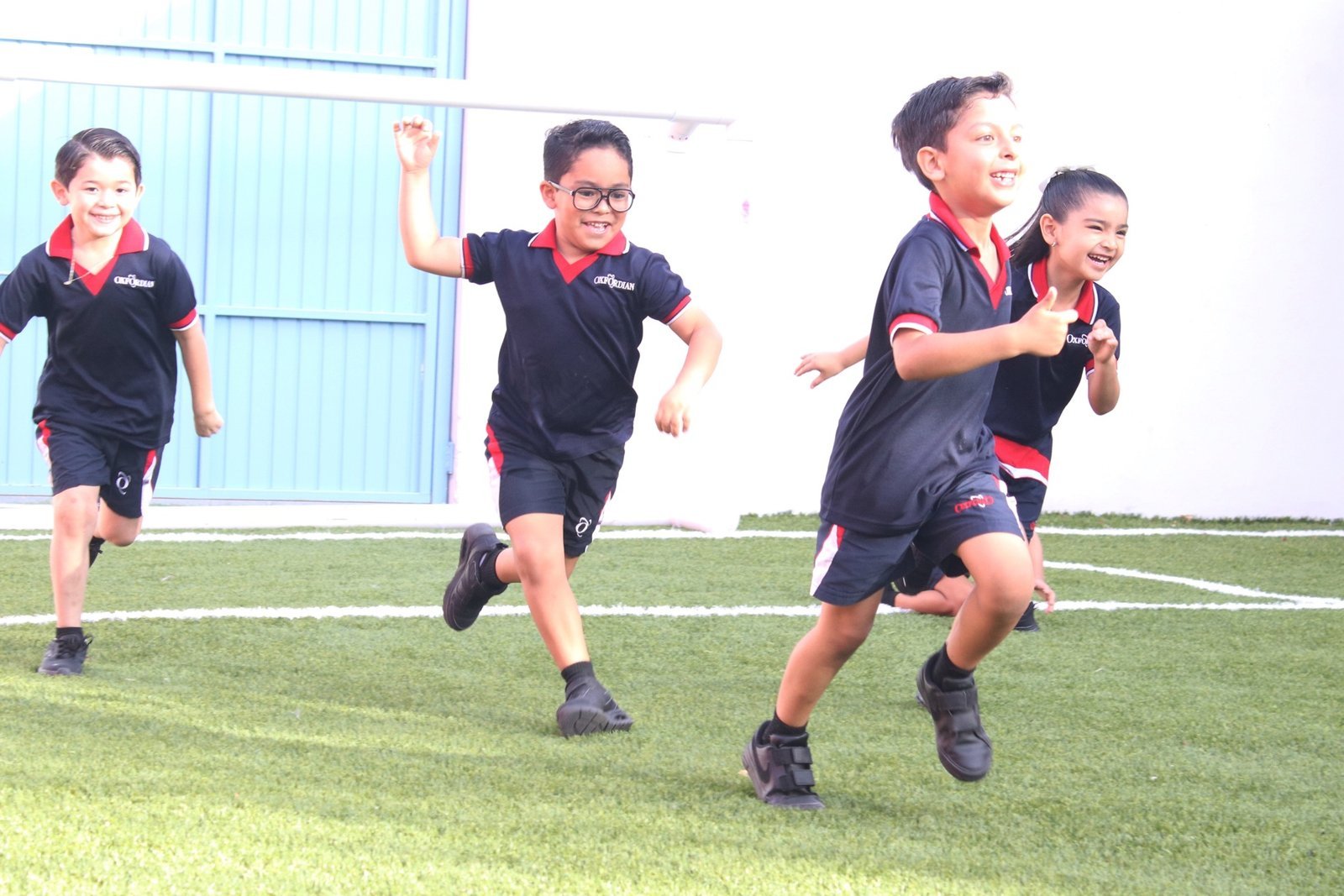 Las Fuentes students running on the pitch