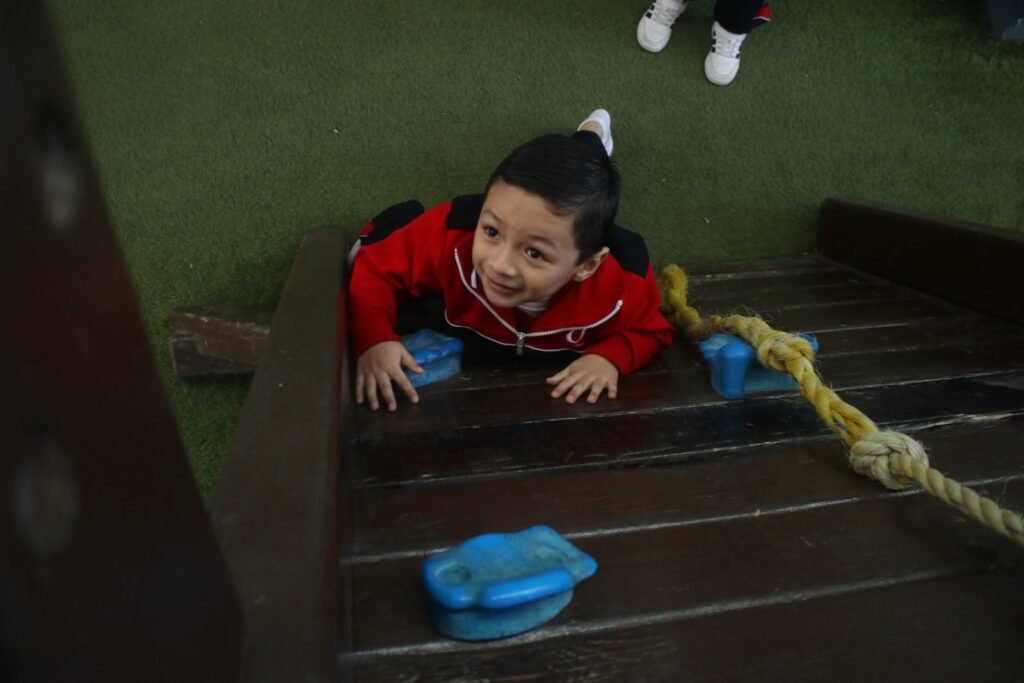 A Las Fuentes pupil climbing in the playground
