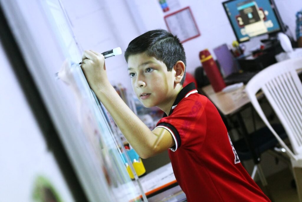 An elementary pupil working at the whiteboard