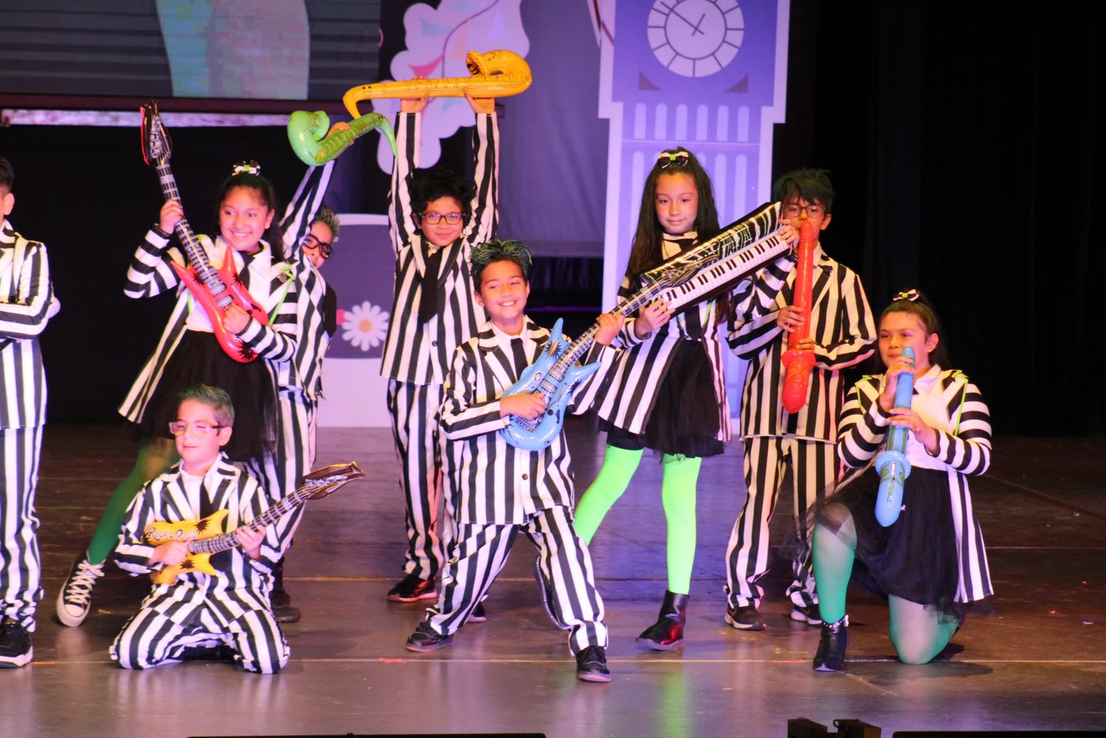 Oxfordian students performing as a band on stage