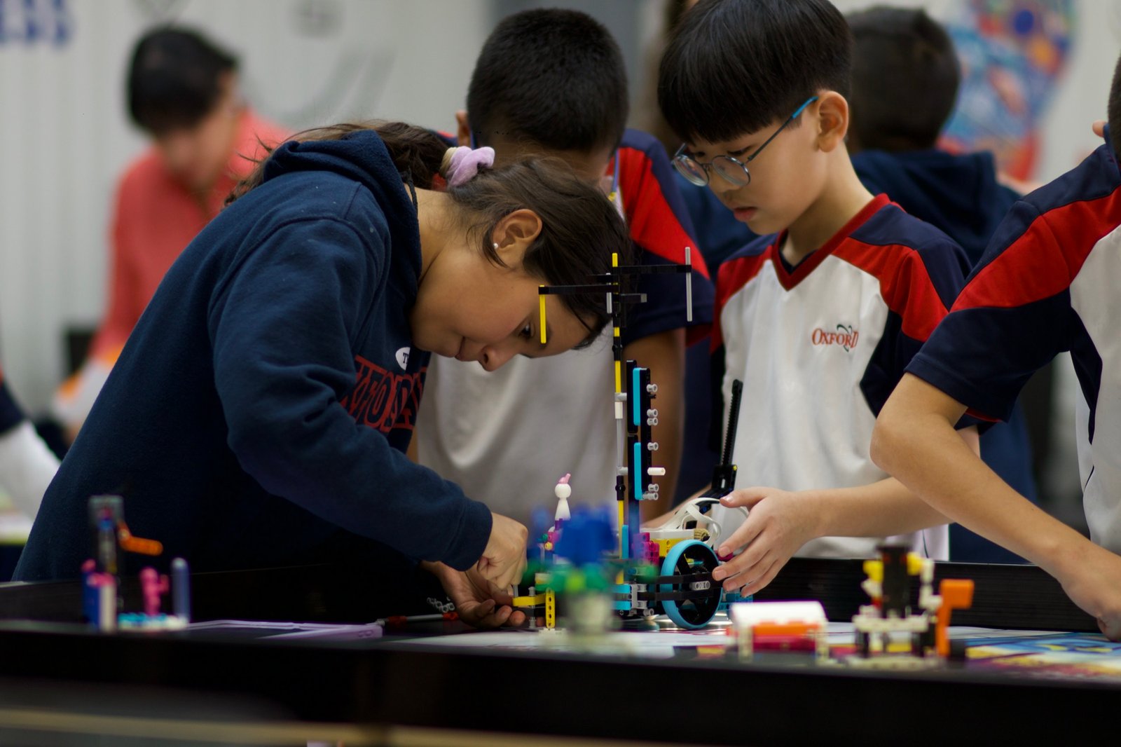 Students building a robot together