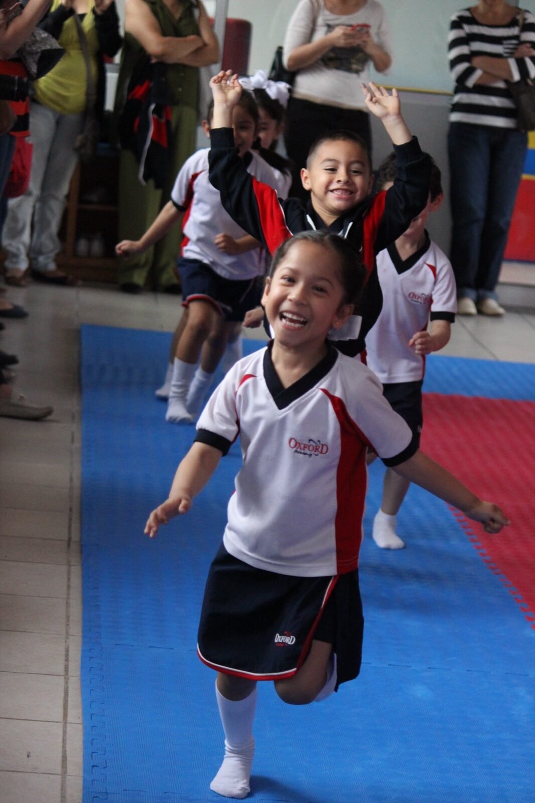 A student mid-leap during a gymnastics display