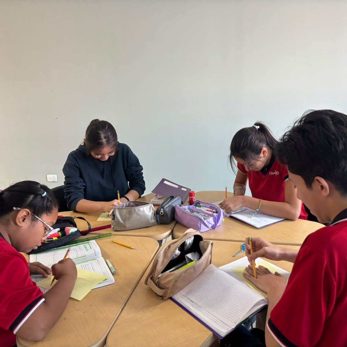 Students writing at their desks during a well-being session.